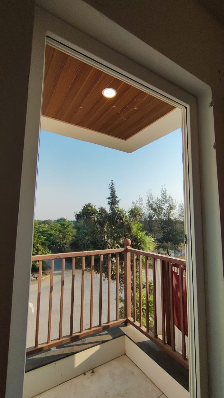View from a private balcony over green surroundings