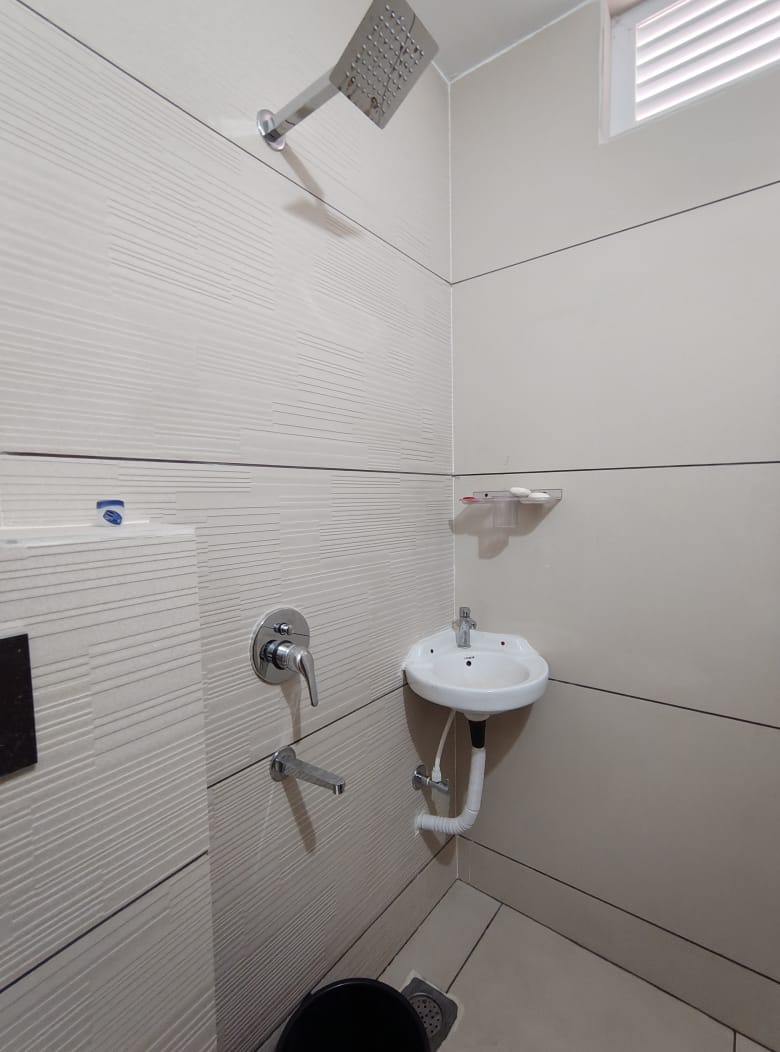 Attached bathroom with rain shower