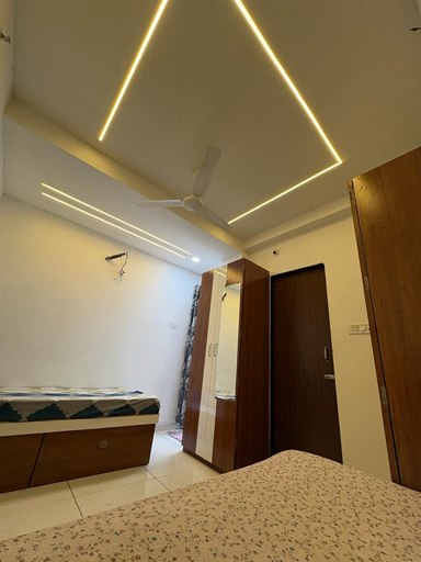 Room with wardrobe mirror and door