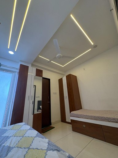 Premium wood-furnished room with cove lighting